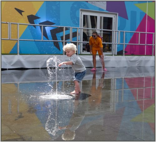 C Advanced - Child Playing in Fountains by Brian Truslove